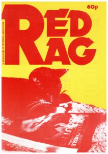 The front cover of Red Rag magazine. A cat lies on a bed with a magazine. Red against a yellow background.