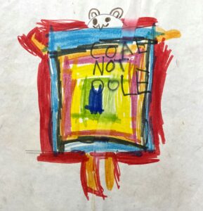 Child’s drawing of a rainbow mining picket reading “Coal Not Dole.” The rainbow has what appears to be a cat or a bear poking its head above it. 