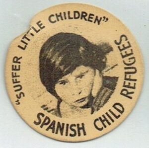 A yellow badge, featuring a picture of a child in the centre, with the words, "Spanish Child Refugees" around the edge 