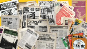 A photo featuring the front covers of a range of 'People's Papers' including the Moss Side People's Paper, the Manchester Free Press and the North Manchester Eye. 
